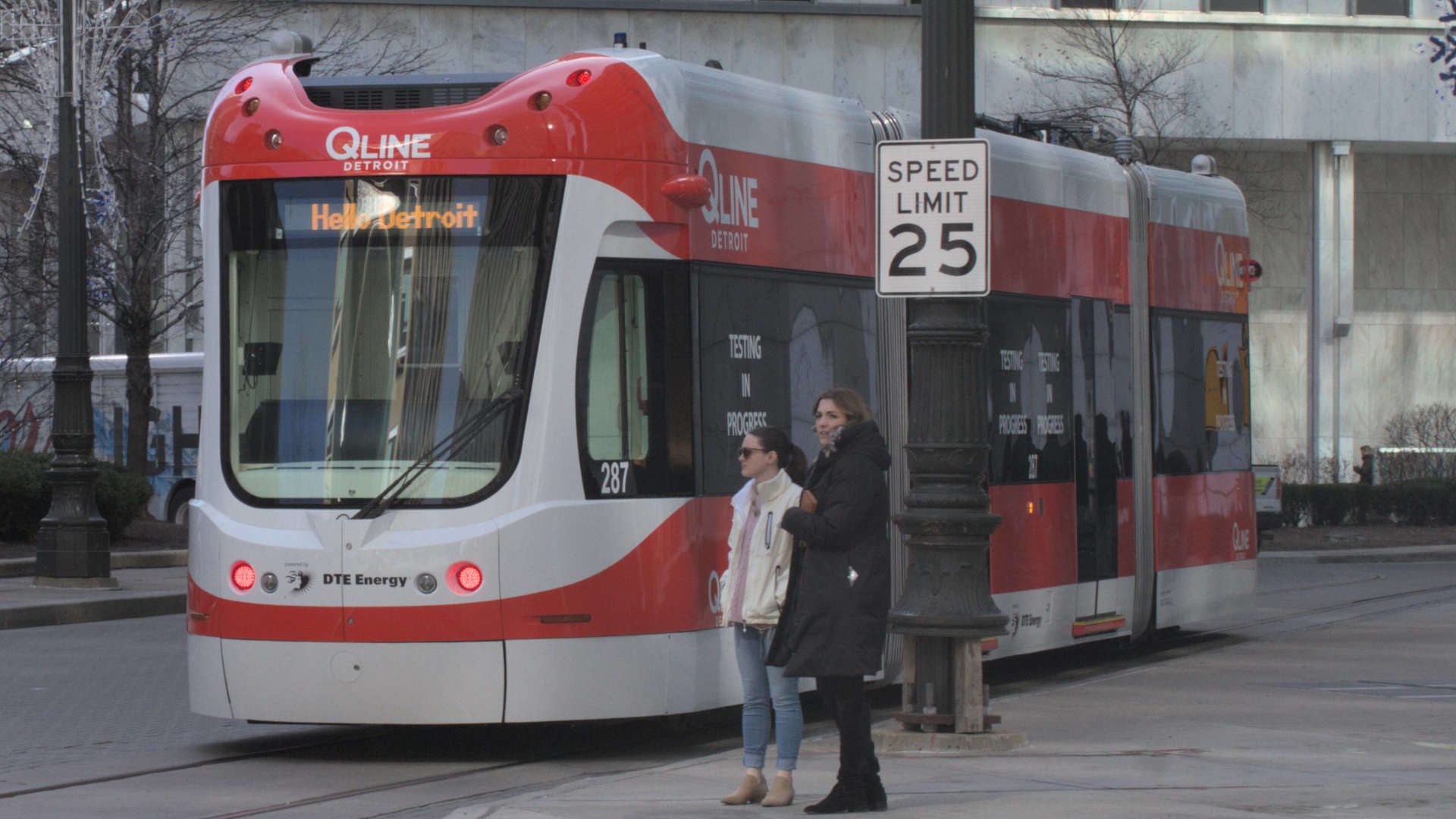 A Qline streetcar moves up Woodward Avenue near Campus Martius in downtown Detroit. 